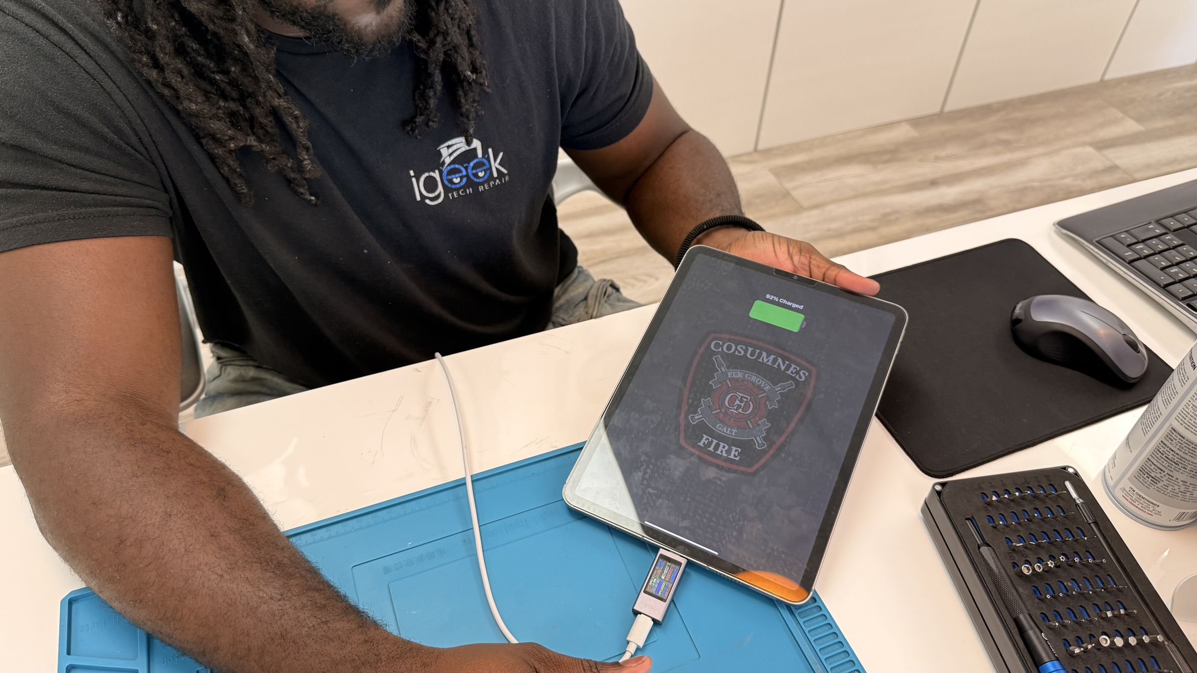Professional technician working on android tablet repair