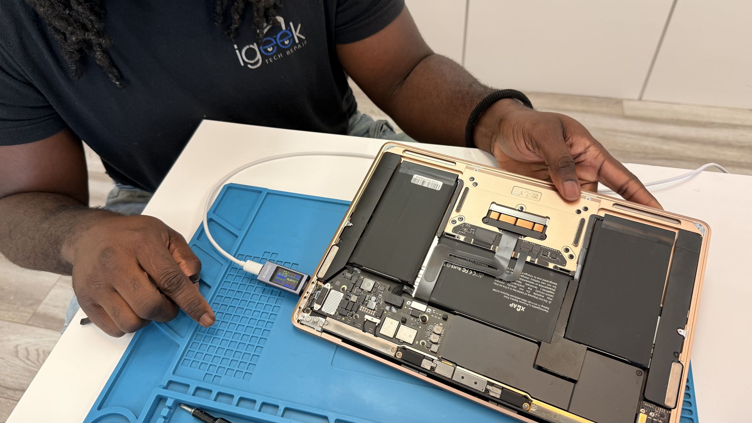 Professional technician working on macbook repair